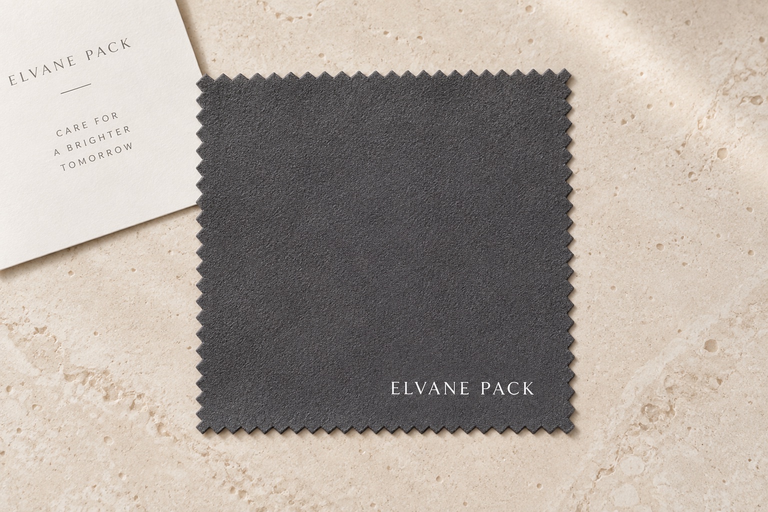 Dark grey polishing cloth with printed Elvane Pack logo