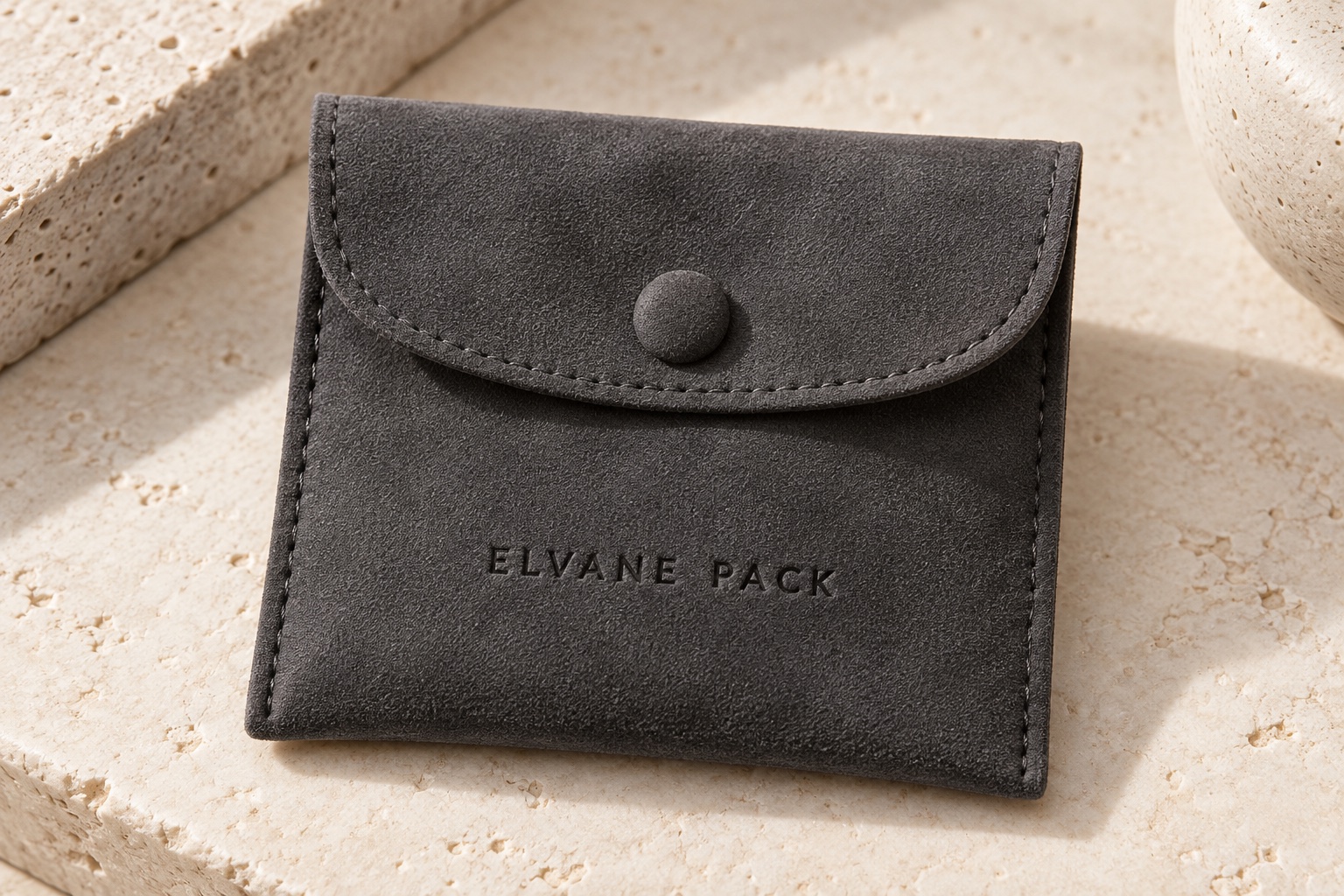 Charcoal microfiber jewellery pouch with debossed Elvane Pack logo